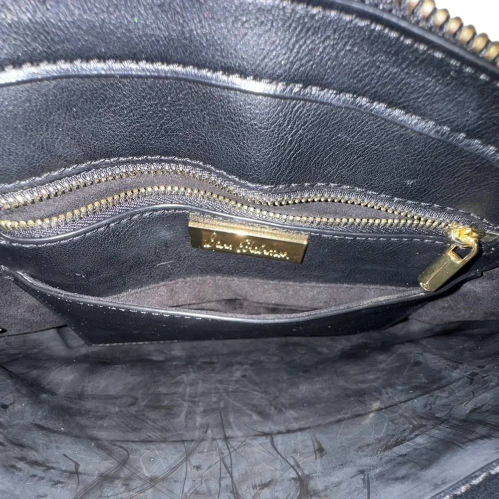 Sam Edelman Faux Leather Black and Silver Eyelet Wristlet Bag